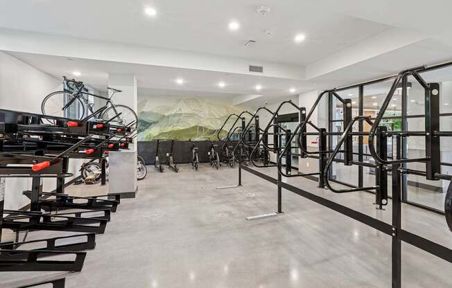 A bike shop with a row of bikes on the wall at Link Apartments® CYKEL Apartments, Charlotte