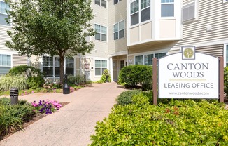 Clubhouse Exterior with Leasing Office Sign | Canton Woods