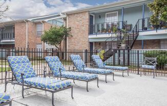 a blue bench in front of a house