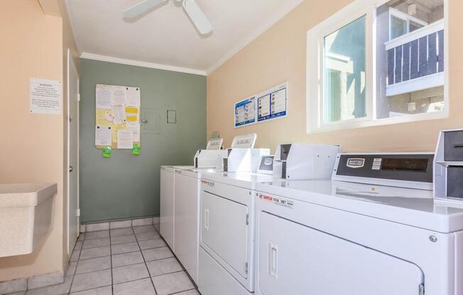 a white refrigerator freezer sitting inside of a kitchen