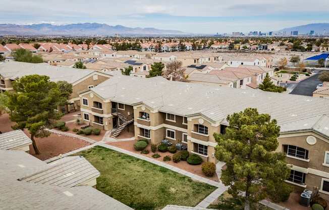 A bird's eye view of a residential area with houses and trees.