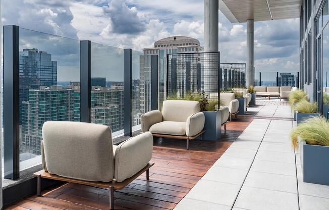 A rooftop terrace with comfortable seating and sweeping Atlanta skyline views creates a relaxed setting to gather above the city.