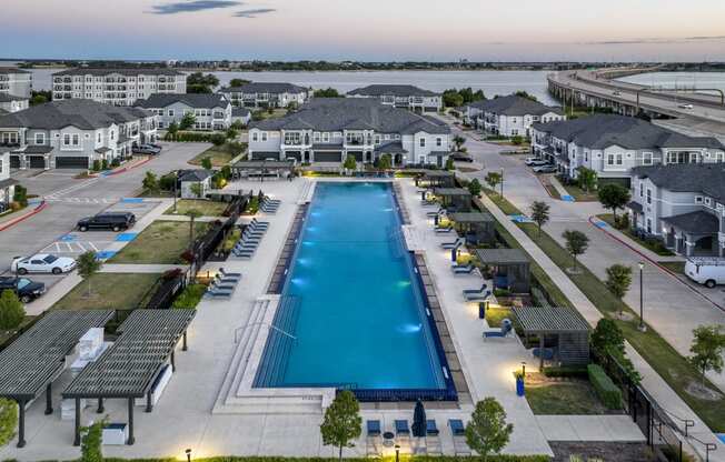 resort-inspired swimming pool at Reveal on the Lake apartments