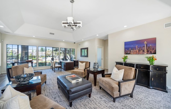 a living room filled with furniture and a large window