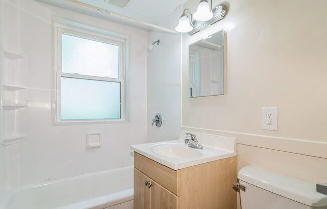 Bathroom with window at Sutterfield Apartments in Providence RI