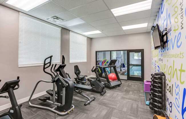 a gym with treadmills and other exercise equipment at The Beckstead, South Jordan, 84095