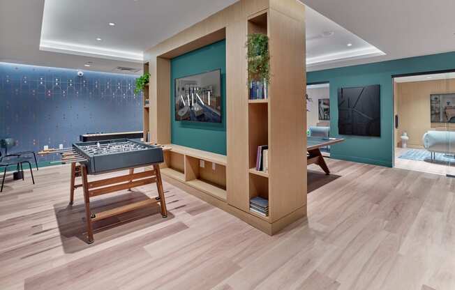 Spacious game room at The Mint Rahway with a foosball table, offering great amenities near Rahway Train Station and Coffee Box Rahway.