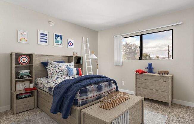 A bedroom with a bed, nightstand, and a window with a view of the outdoors.