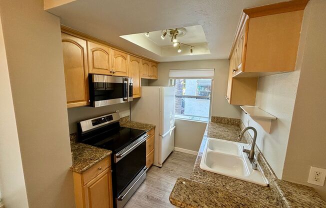 Beautiful 2 BD, 1.5 BA condo w/1 car detached garage for rent in University Heights!