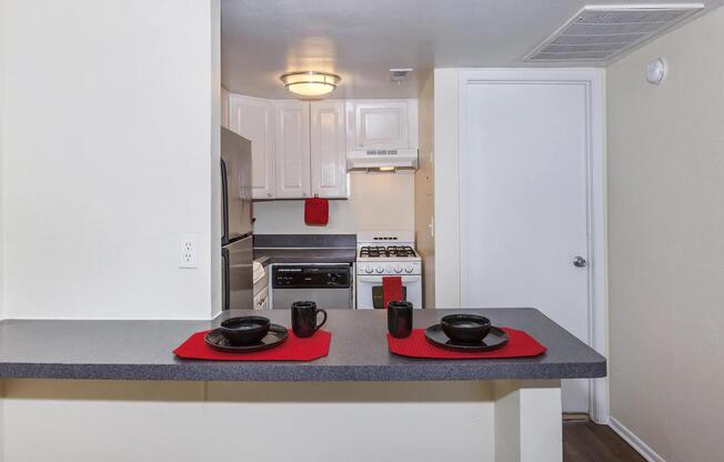 a white refrigerator freezer sitting inside of a kitchen