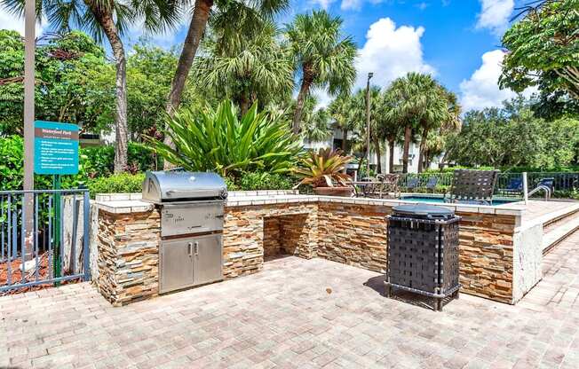 a brick patio with a barbecue grill and two stainless steel appliances at Waterford Park Apartment Homes, LLC, Florida, 33319