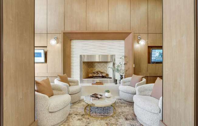 A living room with a fireplace and a TV.