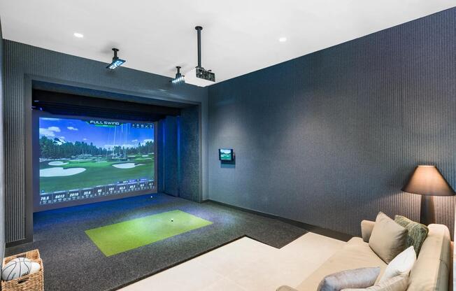 Practice your swing in the indoor golf simulator lounge—perfect for a casual round or sharpening your game.