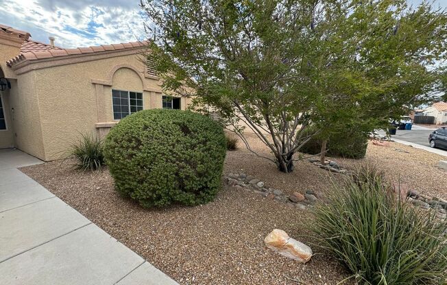 Colorful single story 4 bedroom home with tile flooring.