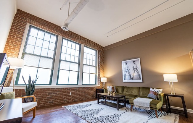 Living Room With Expansive Window at Harness Factory Lofts and Apartments, Indianapolis, IN