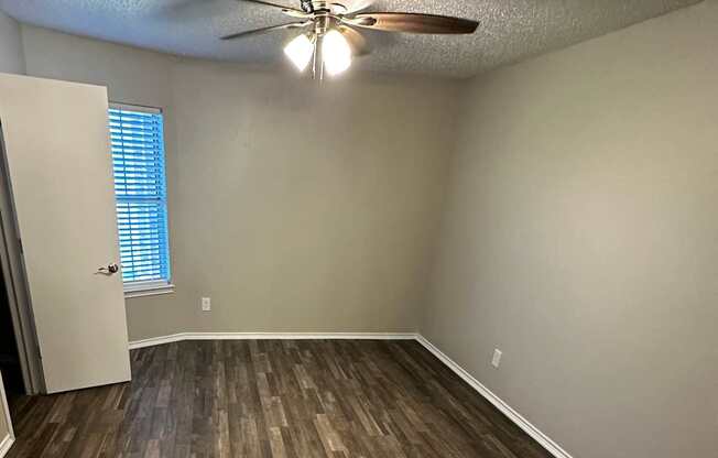 A wall of wood planks runs along the side of a room.