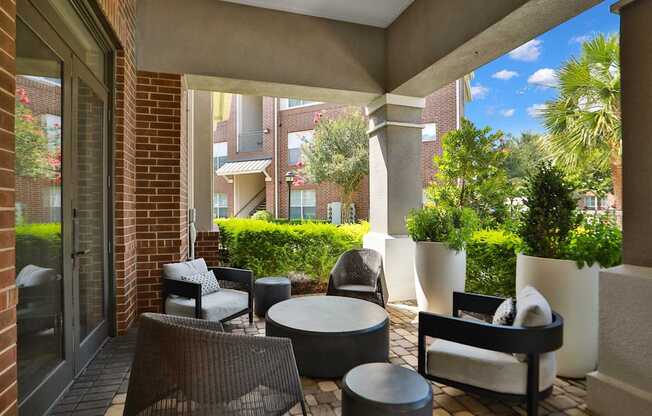 Outdoor Patio Seating at Meadow Apartments in Stafford, TX 77477