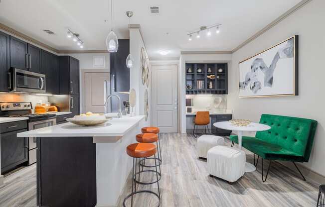 a kitchen and living room with an island and stools