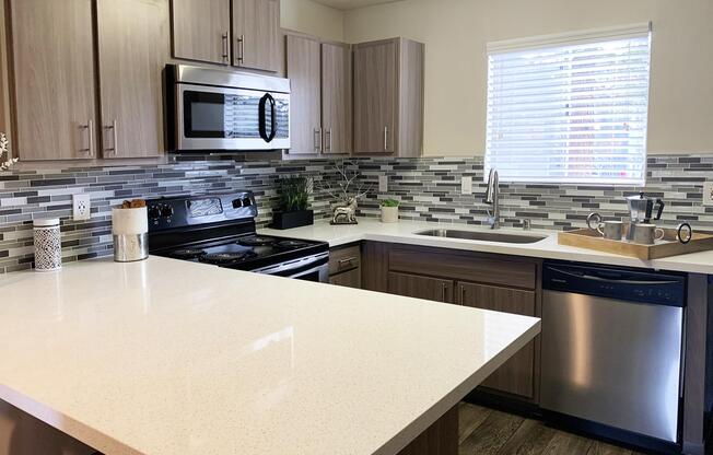 Sunset Hills oversized sink with tile backsplash in kitchen