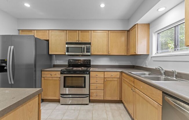 AVAILABLE NOW - Updated 2 Bedroom Duplex w/ Fenced-in Backyard, Large Deck, LVP Floors, Pet Friendly!