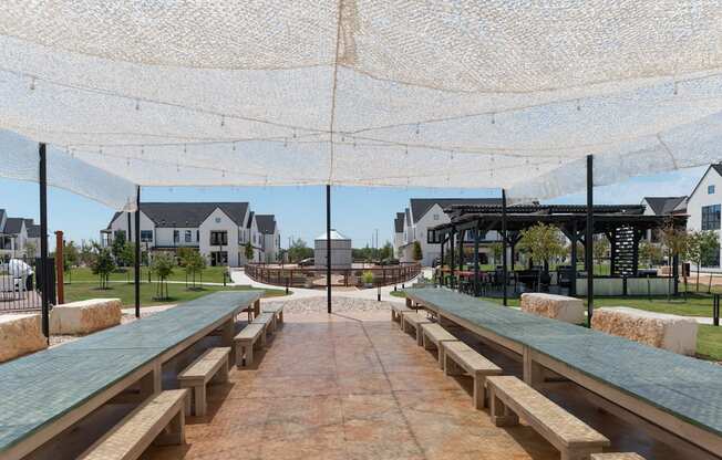 A covered walkway with benches and a canopy.