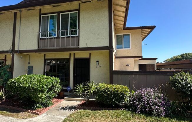 Spacious 3BR/2.5BA updated 2-story townhouse for rent with fenced patio, 2 parking spaces and more