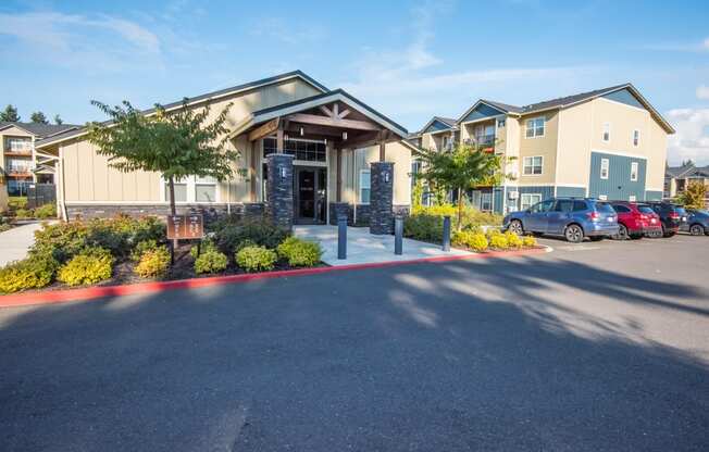 a large building with cars parked in front of it