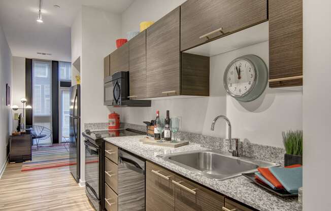 a kitchen with wood cabinets and granite countertops