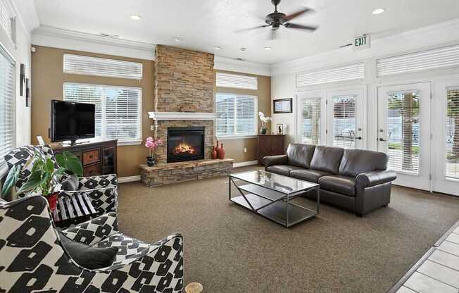 Clubroom With Fireplace And TV at Oakstone Apartments, Clearfield, Utah