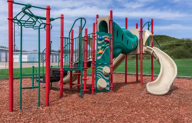 a playground in front of a body of water