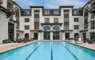 a swimming pool in front of a building