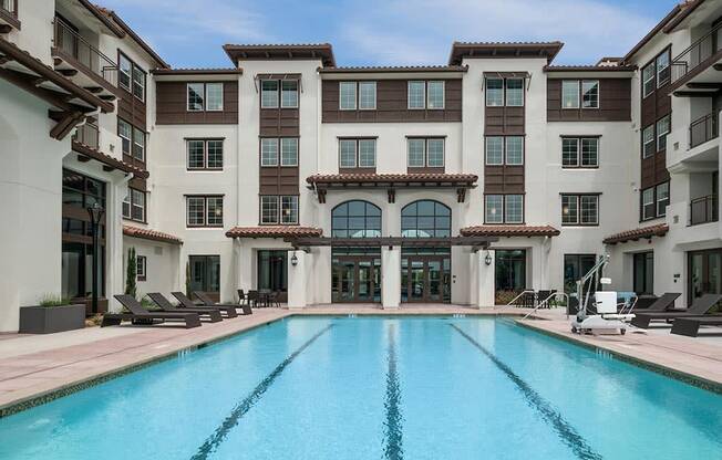 a swimming pool in front of a building