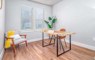 A room with a wooden table and chairs.