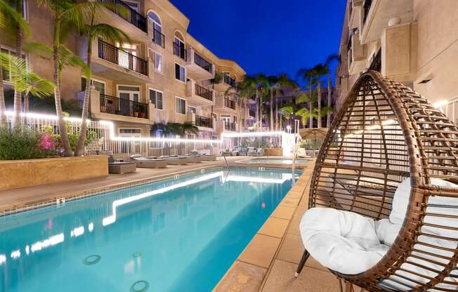 Nightime pool shot with lounge seating