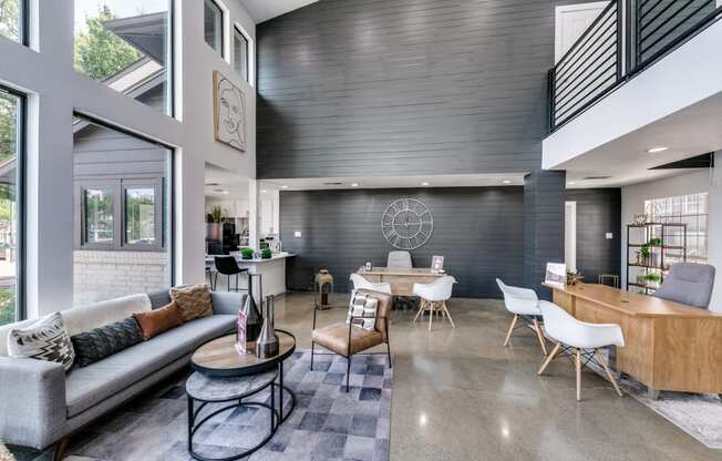 a living room with a couch and a table with chairs