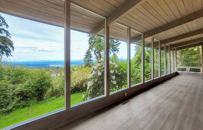 Vintage architectural home looking over Seattle and Bellevue metropolitan skyline.