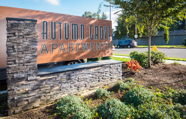 a sign for the autumn grove apartments entrance