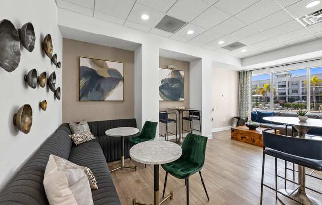 resident seating area with a couch and chairs and a table