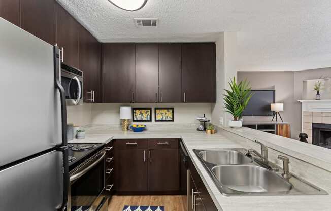 our spacious kitchen is equipped with stainless steel appliances and granite counter tops