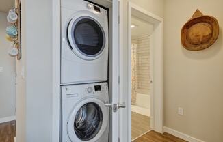 a front loading washer and dryer in a laundry room at L Seven, San Francisco, 94103