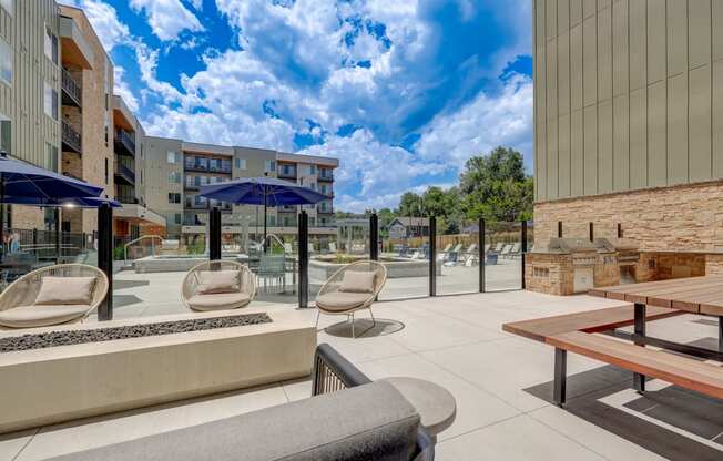 a patio with chairs tables and umbrellas at the bradley braddock road station