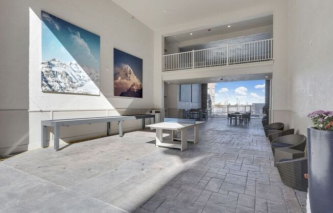 A spacious patio with a table and chairs.
