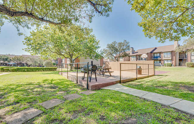 A park area with a bench and a sculpture.