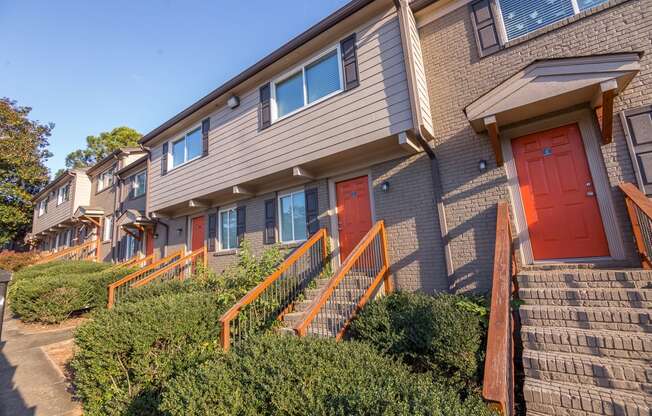 a row of houses with red doors at Broadway at East Atlanta, Atlanta, GA, 30316