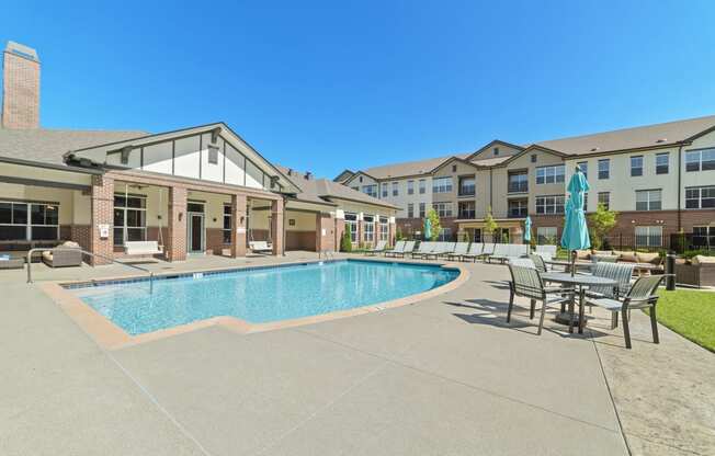 Austin Park Apartments Miamisburg Ohio Pet Friendly Amenity Resort Style Swimming Pool and Sundeck with Shaded tables and lounge chairs