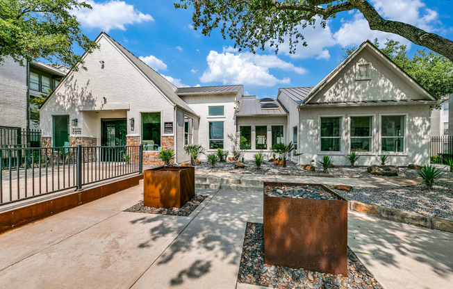 the yard of a house with a courtyard and a fence