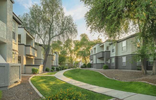 a view of a street with houses and trees