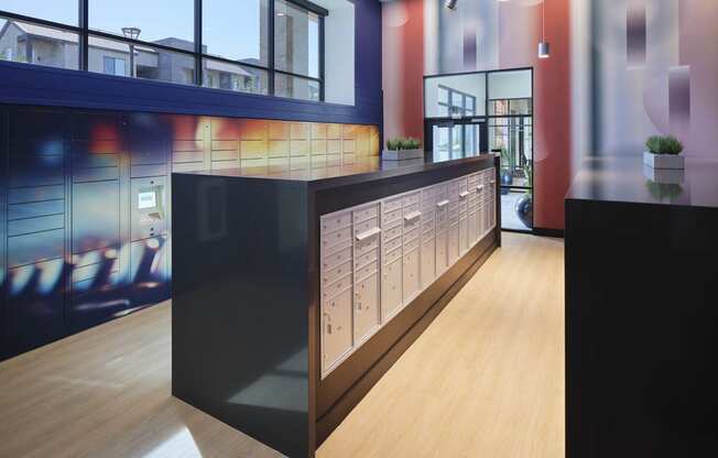 a long counter in a lobby of a building with windows
