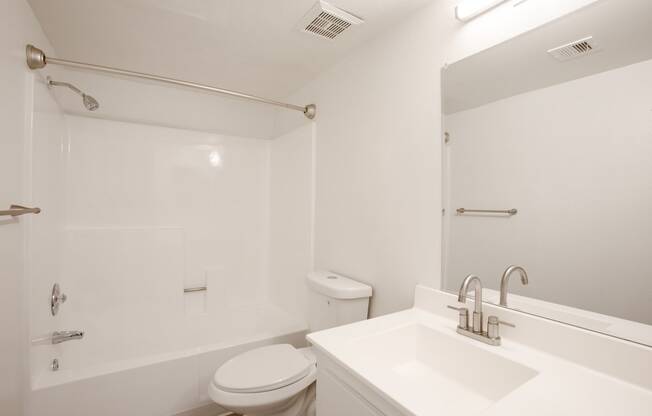 a bathroom with a sink toilet and a shower