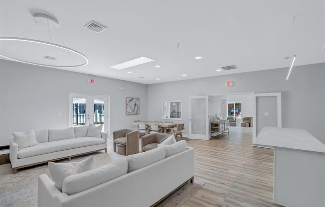 a living room with couches and chairs and a table